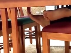 Candid bare feet in library