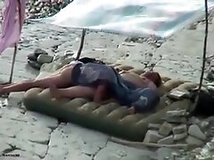 Amateur couple is having sex on the beach