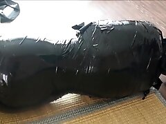 Japanese girl mumified and gagged with clear medical tape