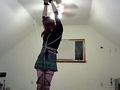crossdresser in multiple bondage positions 3