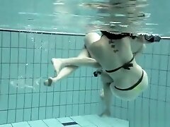 Girls swimming underwater and enjoying eachother